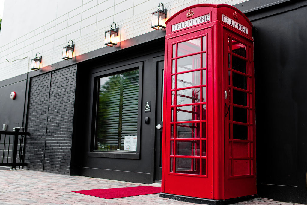 The red phone booth entrance at Red Phone Booth Buckhead.