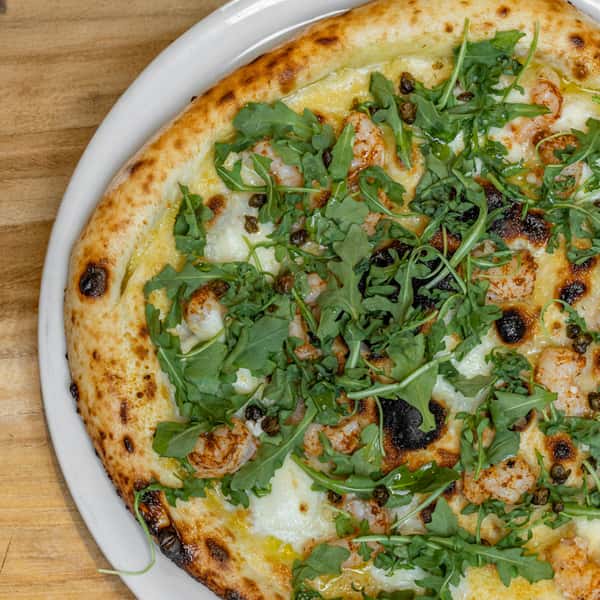 Brickell Shrimp Pizza pictured on the Red Phone Booth menu.